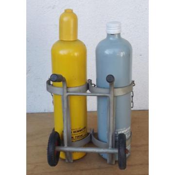 Linde Acetylene/Corgon Schnapps bottles on hand trucks - Decorational object